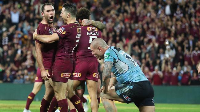 Cameron Smith celebrates victory with Cooper Cronk. Picture: Brett Costello