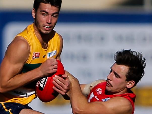 17/4/16 SANFL: Rhys Woods of the Eagles clashes with Alexander Spina of North. Eagles v North Adelaide at Woodville Oval. Picture by Matt Turner.