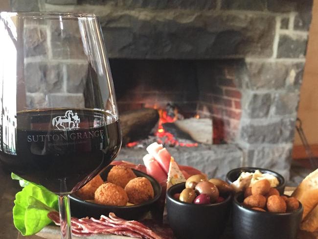 Suttons Grange fireplace in Bendigo, complete with snacks. Picture: Supplied