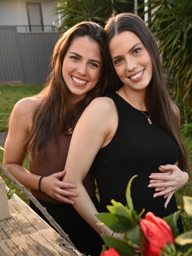 Brisbane sisters Holly, 23, and Ashley Creak, 25, pregnant with her first child, says they are both optimistic about the future. Picture: Lyndon Mechielsen