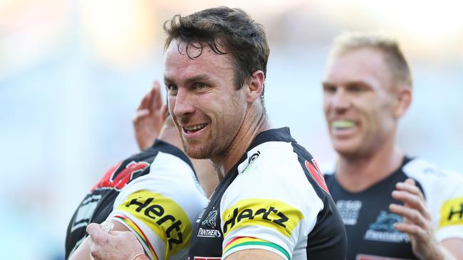 Penrith's James Maloney celebrates after he set up a try for Penrith's Josh Mansour during the Parramatta Eels v Penrith Panthers rugby league match at ANZ Stadium, Homebush. Picture: Brett Costello