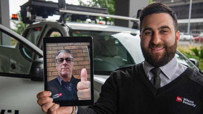 Security guard Claudio Cominotto, appearing via video call, and duty manager Peter Mikha have been praised for their quick action when two German travellers landed at Melbourne without quarantining in Sydney. Picture: Jason Edwards