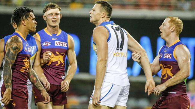 Steven May of the Suns is harrassed by Lions players after his hit on Stefan Martin of the Lions during Round 4 AFL match between the Brisbane Lions and Gold Coast Suns at the GABBA, Brisbane, Saturday April 16, 2016. (AAP Image/Glenn Hunt) NO ARCHIVING, EDITORIAL USE ONLY