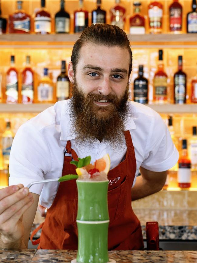 Calypso Club head bartender Baily Martland mixes some rum cocktails to serve up to thirsty customers. Picture: Brendan Radke