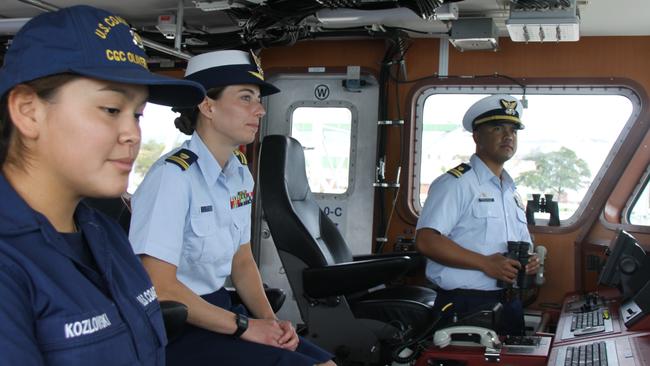 Lt. Freddy Hofschneider, commanding officer, Li JG Marissa Marsh and Fireman Malie Kozlowski on the bridge of US Coast Guard cutter Oliver Henry at HMAS Cairns. Picture: Alison Paterson