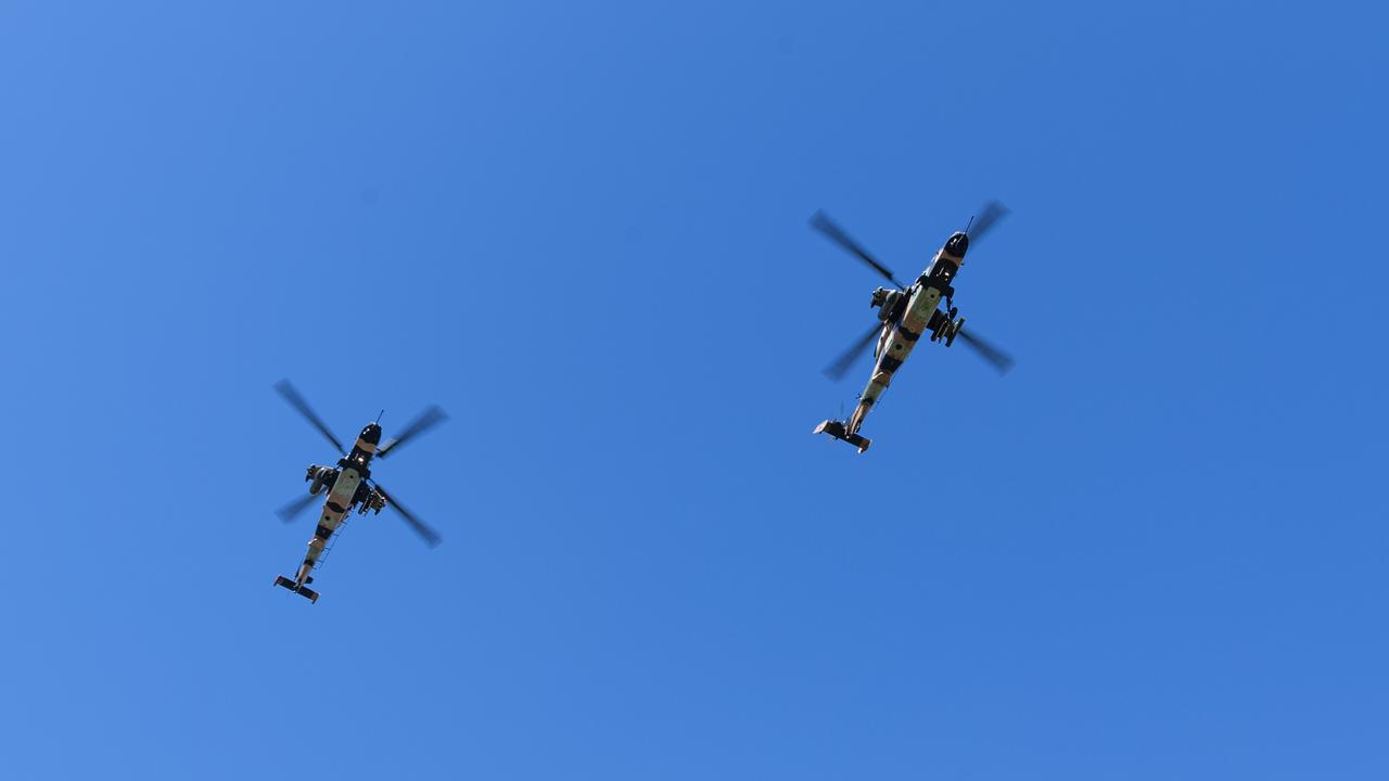 Two ARH Tiger helicopters part of a fly-past of Toowoomba's Anzac Day midmorning service at the Mothers' Memorial, Thursday, April 25, 2024. Picture: Kevin Farmer