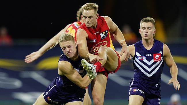 Darcy MacPherson of the Suns kicks during the Round 4 AFL match between the Gold Coast Suns and the Fremantle Dockers (AAP Image/Dave Hunt)