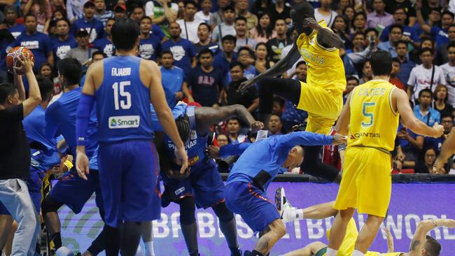 Boomer Thon Maker launches at Philippines players at the Philippine Arena as the brawl breaks out. Picture: AP Photo/Bullit Marquez