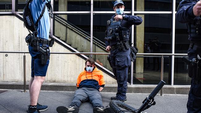 A protester is detained by police in Sydney. Picture: NCA NewsWire / Flavio Brancaleone