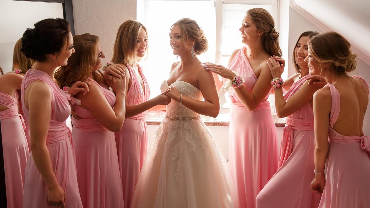 Instead of wearing white, she wore pink and her bridesmaids and the mothers wore white. Picture: iStock