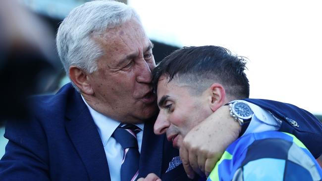 Andrea Atzeni embraces Stefano Cherchi’s father after winning the Sydney Cup. Picture: Jeremy Ng/Getty Images