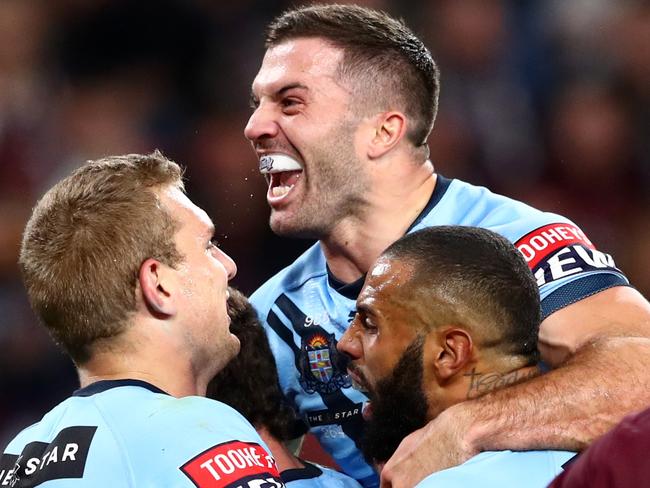 BRISBANE, AUSTRALIA - JUNE 27: Tom Trbojevic of the Blues celebrates after scoring a try with James Tedesco and Josh Addo-Carr of the Blues during game two of the 2021 State of Origin series between the Queensland Maroons and the New South Wales Blues at Suncorp Stadium on June 27, 2021 in Brisbane, Australia. (Photo by Chris Hyde/Getty Images)