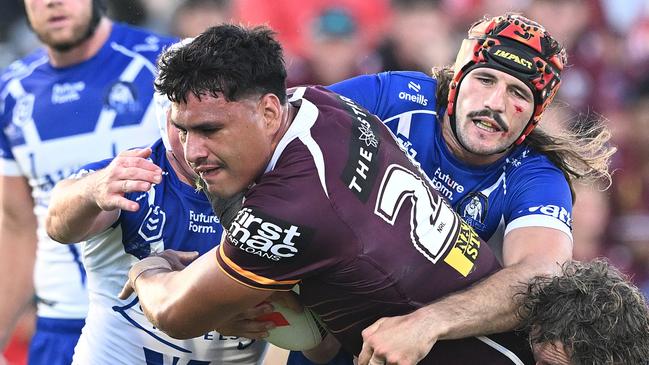 BRISBANE, AUSTRALIA - FEBRUARY 22: Benjamin Te Kura of the Broncos takes on the defence during the 2025 NRL Pre-Season Challenge match between Brisbane Broncos and Canterbury Bulldogs at Kayo Stadium on February 22, 2025 in Brisbane, Australia. (Photo by Bradley Kanaris/Getty Images)