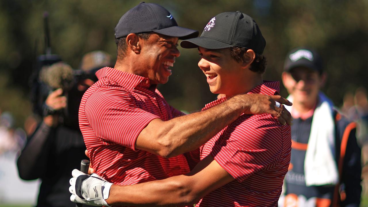 Tiger Woods reacts with his son Charlie Woods after holing out on the fourth hole during the second round of the PNC Championship at Ritz-Carlton Golf Club in Orlando, Florida. (Photo by Mike Ehrmann/Getty Images)