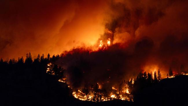 The McDougall Creek wildfire burns in the hills outside Kelowna at the weekend. Picture: AFP