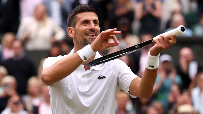 Novak Djokovic of Serbia celebrates winning match point, with a violin gesture, against Lorenzo Wimbledon of Italy. (Photo by Julian Finney/Getty Images)