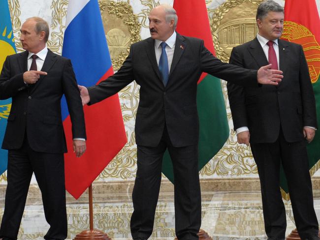 From left, Russian President Vladimir Putin, Belarussian President Alexander Lukashenko and Ukrainian President Petro Poroshenko. Picture: Alexei Druzhinin