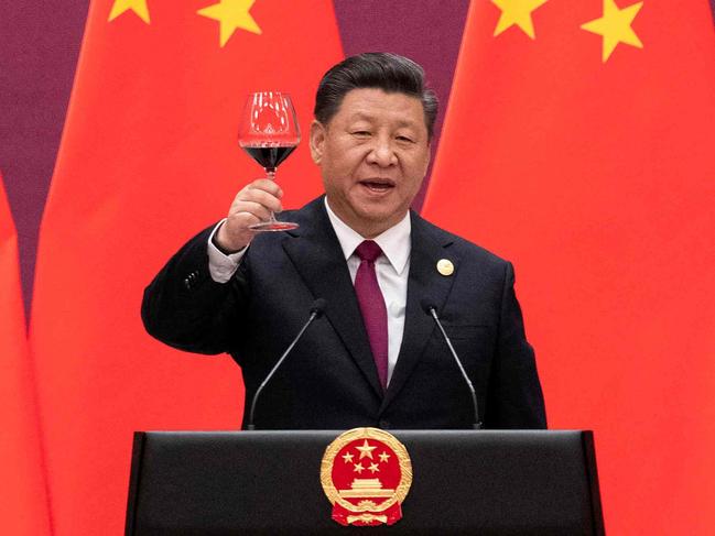 (FILES) In this file photo China's President Xi Jinping raises his glass and proposes a toast at the end of his speech during the welcome banquet for leaders attending the Belt and Road Forum at the Great Hall of the People in Beijing on April 26, 2019. - The global infrastructure plan announced by G7 leaders aims to offer developing nations a credible alternative to China's much-criticized Belt and Road Initiative -- but it faces major hurdles on the ground, especially if Beijing's hiccups are any indication.  US President Joe Biden was able to convince the G7 to sign onto the initiative, drawing allies into Washington's strategic rivalry with Beijing, under a plan titled "Build Back Better World" (B3W) that aims to provide hundreds of billions in infrastructure investment to developing nations. (Photo by Nicolas ASFOURI and NICOLAS ASFOURI / POOL / AFP)