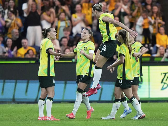The Matildas celebrate after taking a 1-0 lead over South Korea thanks to an own goal. Picture: AP Photo/Rick Rycroft