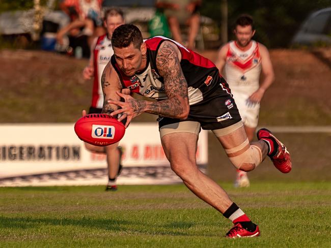 Districts’ Farrer scrambles for the ball in round 3 of the NTFL. Picture: Warren Leyden / AFLNT Media