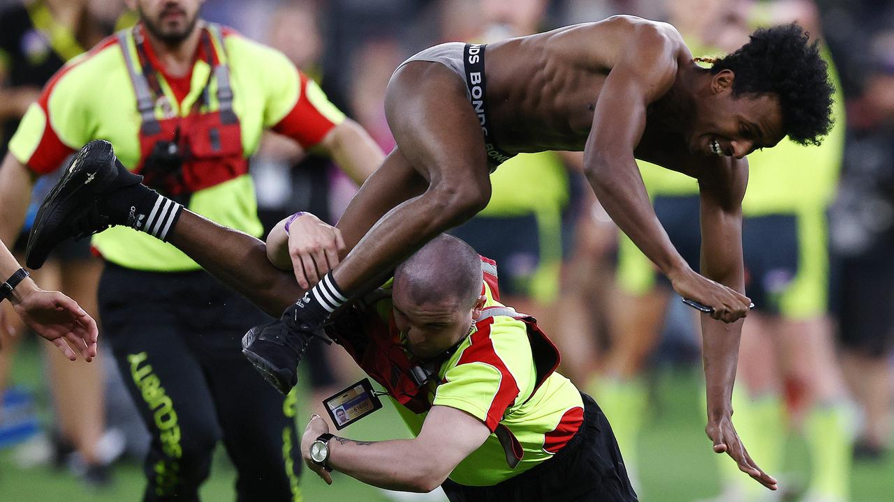 Bol was tackled to the ground by security. Picture: Michael Klein