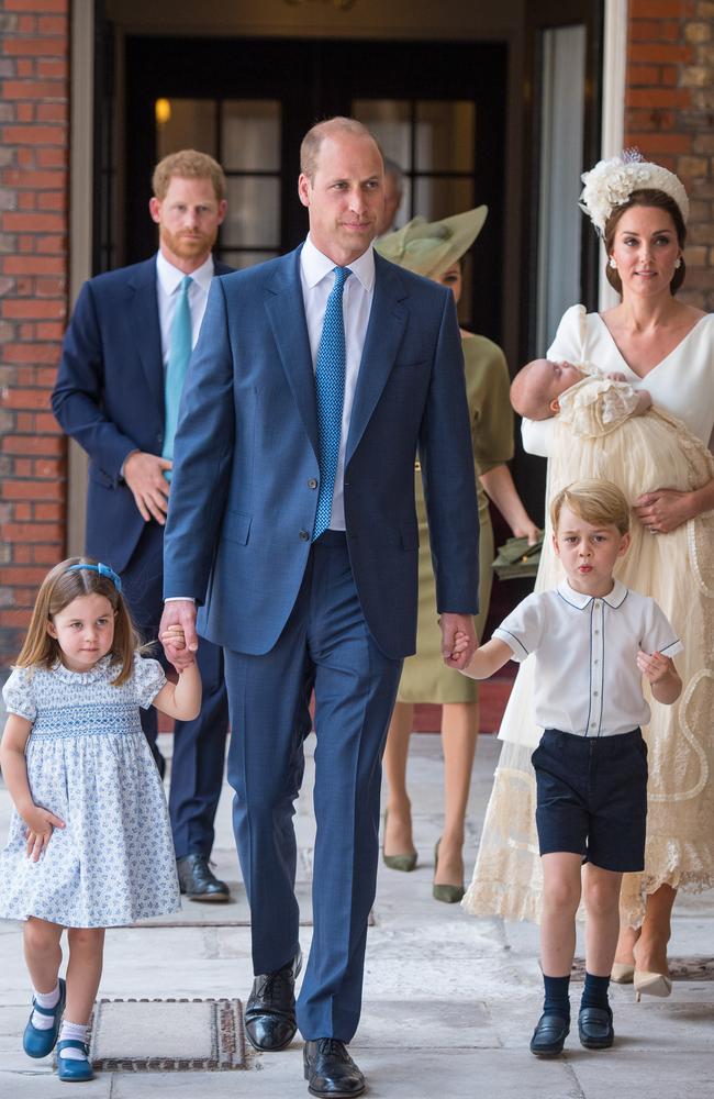 Prince George holds the hand of his father, Prince William, as they arrive for the christening of his brother, Prince Louis. Picture: Dominic Lipinski/WPA Pool/Getty Images