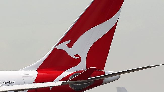 A Qantas Airways Ltd. aircraft, left, and a Virgin Australia Holdings Ltd. aircraft taxi 