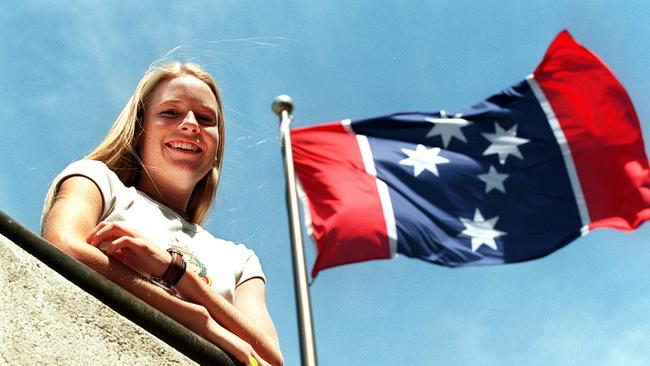 Keria Riley with an Austflag  design for a new Australian flag minus the Union Jack  on Australia Day in 1997. Picture: Marc Vignes