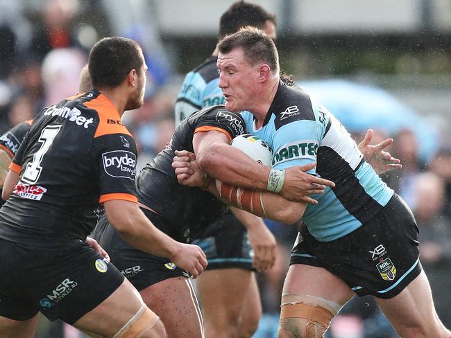 Paul Gallen crashes through the Tigers for a try. Picture: Brett Costello