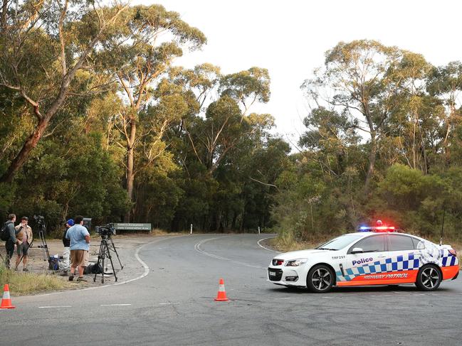 Police cordoned off a road leading to Robertson Lookout at Mount Keira. Picture: Richard Dobson