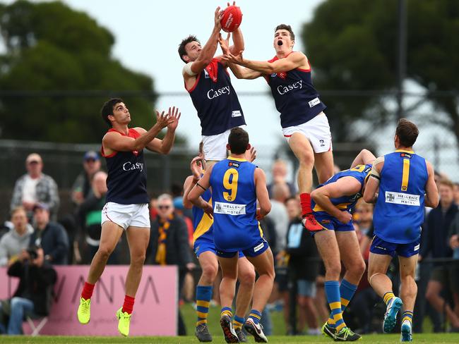 MELBOURNE, AUSTRALIA - APRIL 17:  Cameron Pedersen (L) and Jordan Moncrieff of the Casey Demons attempt to mark the ball during the round one VFL match between Williamstown and Casey Demons on April 17, 2017 in Melbourne, Australia.  (Photo by Jack Thomas/AFL Media/Getty Images)