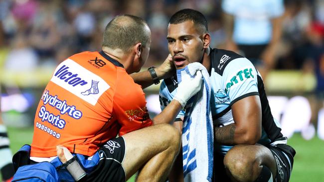 Sione Katoa of the Sharks left the field with a suspected broken jaw during the Round 1 NRL match between the North Queensland Cowboys and the Cronulla-Sutherland Sharks at 1300 SMILES Stadium in Townsville, Friday, March 9, 2018. (AAP Image/Michael Chambers) NO ARCHIVING, EDITORIAL USE ONLY