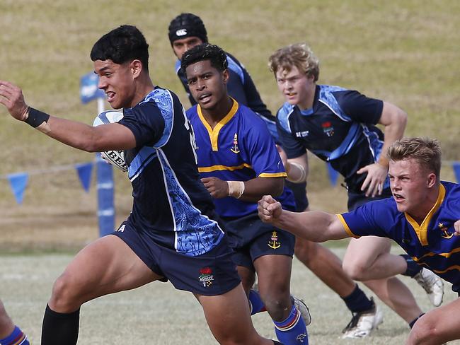 CCC's Savelio Tamale charges through the line. CCC (2 tone blue ) v SJRU (blue and gold ). Action from game. Junior Rugby. NSW Schools Rugby union trials at Eric Tweedale Oval. Picture: John Appleyard