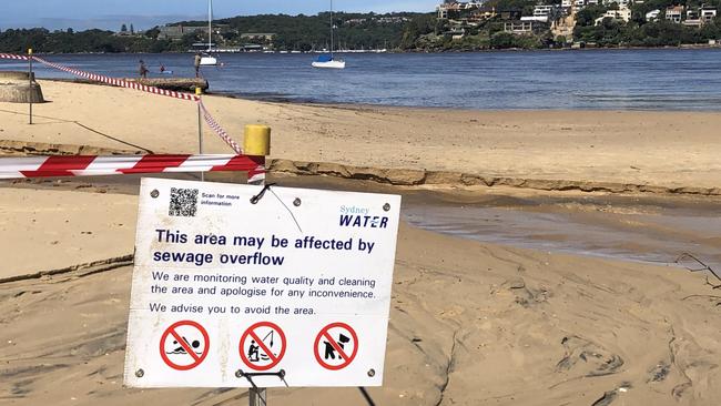 Northern Beaches Council has closed all beaches and warns people to stay out of the water due to stormwater and possible sewage contamination. A sign at Clontarf Reserve on Saturday morning. Picture: Jim O’Rourke