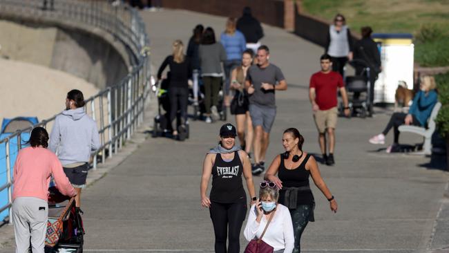 Locals were out in Bondi on Friday before going into lockdown. Picture by Damian Shaw