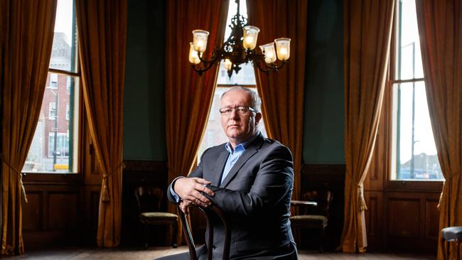 National Trust SA chief executive Dr. Darren Peacock in Ayers House State Dining Room beneath the first house lamps to be lit by gas in Adelaide. Picture Matt Turner.