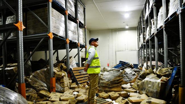 Wrecked – Prime Minister Scott Morrison visits Norco’s Lismore ice-cream factory, which had 4m of water sweep through it. Picture: Elise Derwin