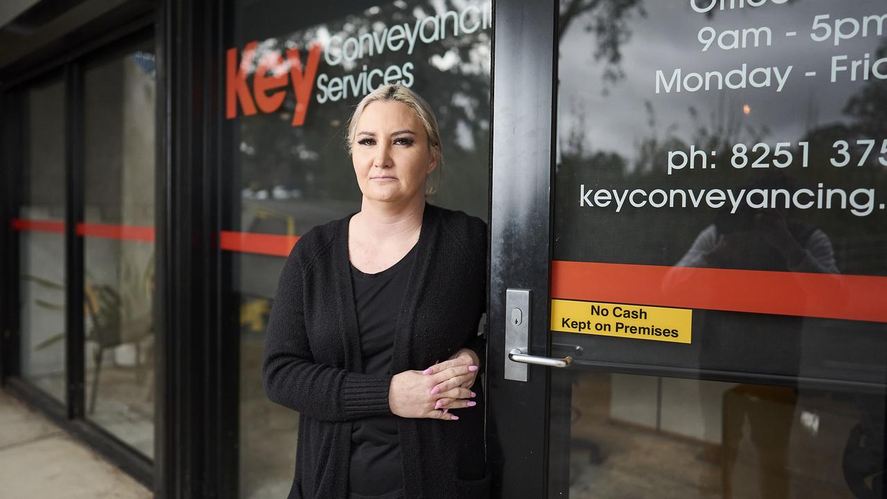 Melissa Belton outside her flooded office in Modbury, after a main sewage pipe blockage that created back-flow into her office. Picture: Matt Loxton