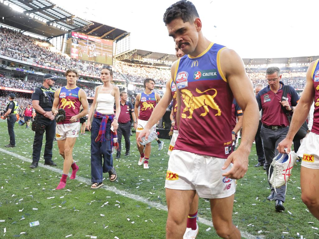 A shattered Charlie Cameron and his Brisbane teammates leave the ground after losing last year’s AFL grand final. Picture Lachie Millard