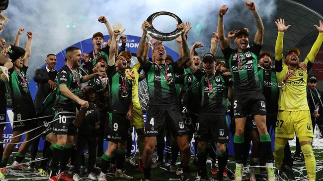 MELBOURNE, AUSTRALIA - MAY 28: Leo Lacroix of Western United holds the trophy aloft during the A-League Mens Grand Final match between Western United and Melbourne City at AAMI Park on May 28, 2022, in Melbourne, Australia. (Photo by Robert Cianflone/Getty Images)