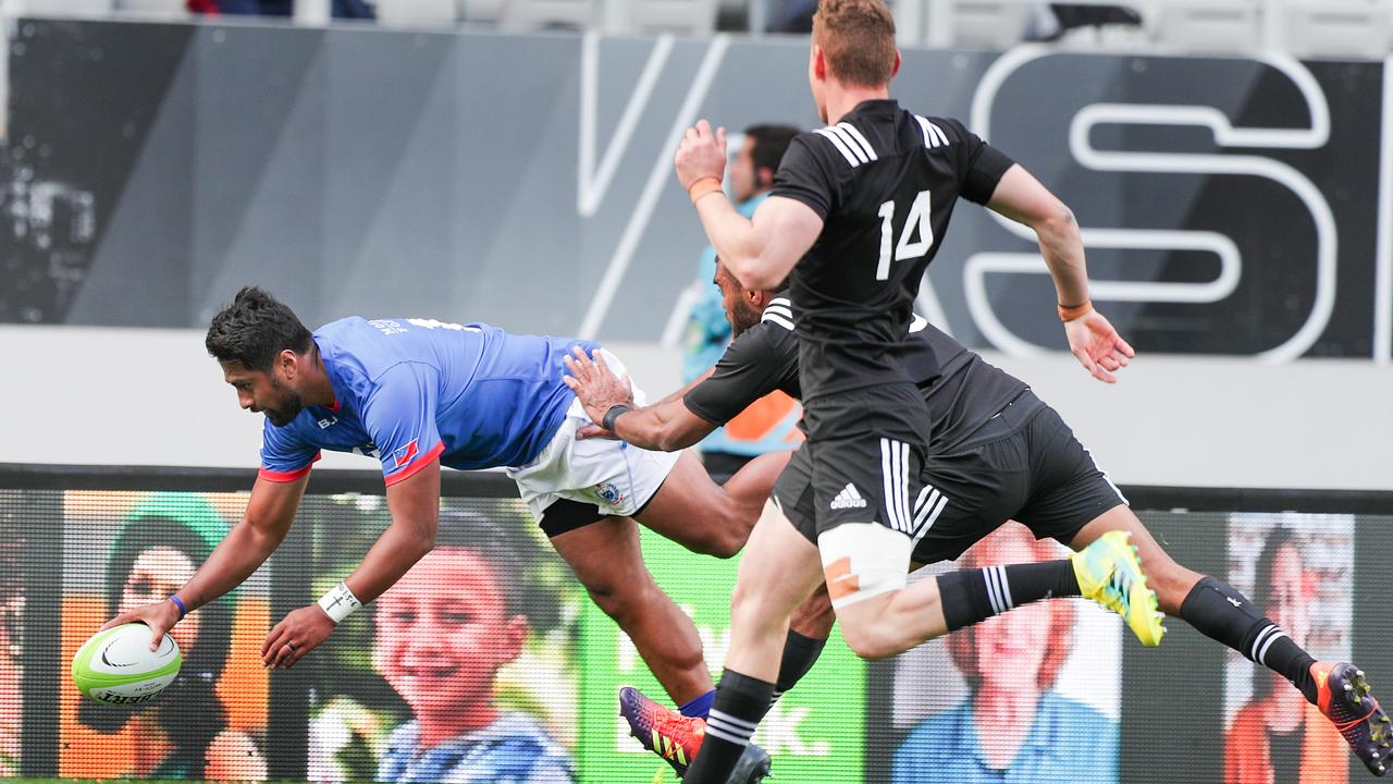 Ahsee Tuala of Manu Samoa scores a try at Eden Park.