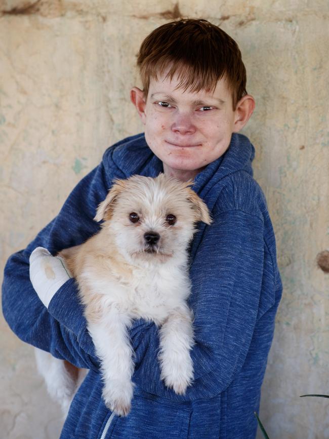 John Hutchins with Penny, his small maltese shih tzu. Picture Matt Turner.