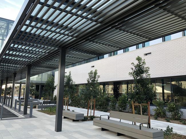 The exterior at the new Northern Beaches Hospital in Frenchs Forest. Seating and plants are in place. Picture: Julie Cross.