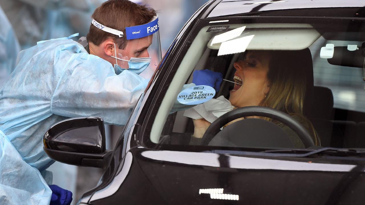 A member of the Australian Defence Force takes a swab sample at a drive-through COVID-19 coronavirus testing station in the Melbourne suburb of Fawkner. Photo: William WEST / AFP.