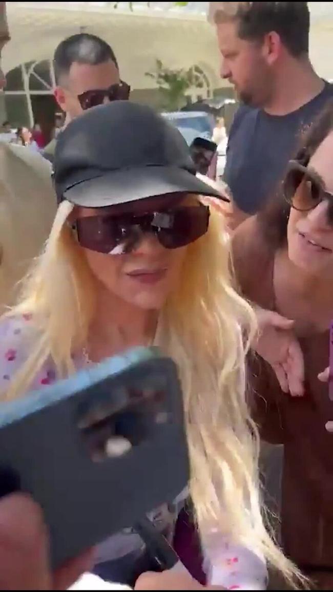 Christina Aguilera kissed by fan during autograph signing