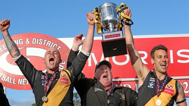 Daniel Measures (right) with coach Ron Pilgrim and Jack Brauman after Bannockburn’s premiership win in 2022. Picture: Mark Wilson