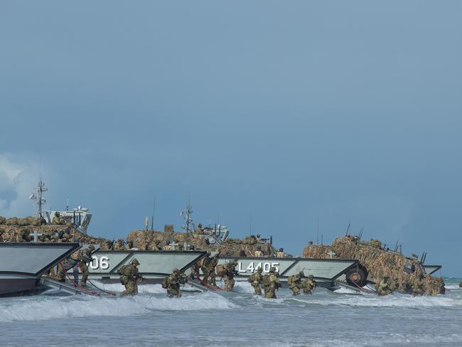 Soldiers from 2nd Royal Australian Regiment disembark an LCM-8 Landing Craft from HMAS Canberra during a major amphibious beach landing operation during Exercise Talisman Saber.