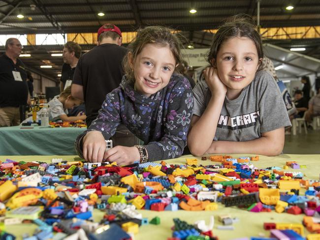 On holiday from Canada, Tilly and Layla Donnelly play in the lego area. Toowoomba Royal Show. Saturday, April 1, 2023. Picture: Nev Madsen.