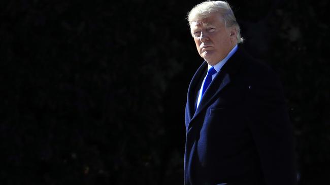 President Donald Trump walks from the Oval Office as he leaves the White House on Friday. Picture: AP Photo/Manuel Balce Ceneta