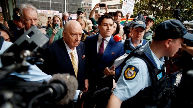 Alan Jones is swarmed by media and hecklers as he leaves the Downing Centre. Picture: NewsWire / Nikki Short